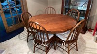 Wooden pedestal dining table with five chairs