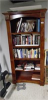 BOOKCASE AND BOOKS. LOCATED IN BASEMENT