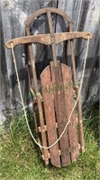 Antique childs sled measuring 45 inches long.