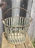 Antique metal egg gathering basket with swivel