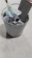 Galvanized bucket of misc oils