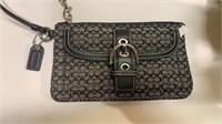 Marked Smart Coach Double C wallet with a zipper