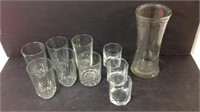 Assorted glasses and vase