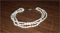 Three stranded Freshwater Pearl bracelet 8 inches