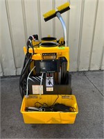 Kaivac yellow power cleaning cart on casters