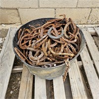 Galvanized Wash Pail full of  Horse Shoes