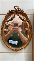 SMALL CARVED GOLD OVAL MIRROR 17" TALL