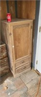 Old single door cabint with two drawer bottom.