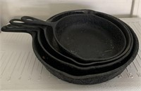 E - LOT OF 4 CAST IRON SKILLETS (G225)