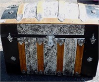 Antique dome top trunk. Wood and tin (metal).
