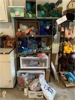 Metal shelving unit with yarn and more