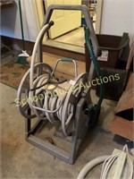 Hose on reel and sprinkler