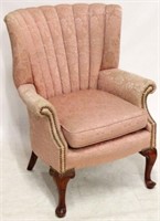 Vintage pink upholstered channel back chair