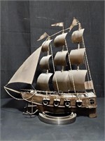 Metal pirate ship on circular rotating stand