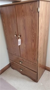 Tall wardrobe / storage cabinet with shelves.