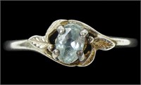 Sterling silver oval cut claw set blue topaz ring
