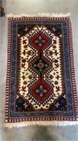 Small hand woven oriental rug measures 28 x 18.