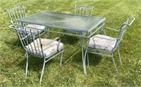4 wrought iron chairs and glass top table - 31" x