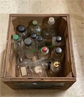 Wooden box of vintage bottles to include