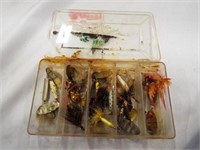 Vintage fishing lures in small plastic tackle box