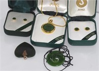 Five various greenstone earrings / pendants
