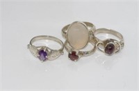 Four various stone set silver rings