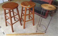 2 bar stools and a plant stand