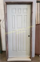 Metal exterior door in frame