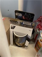 2 star wars mugs, 1 mandalorian and 1 darth vador