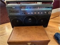 Boom Box Stereo with Case of Cassette Tapes