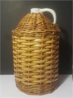 Ceramic jug in basket