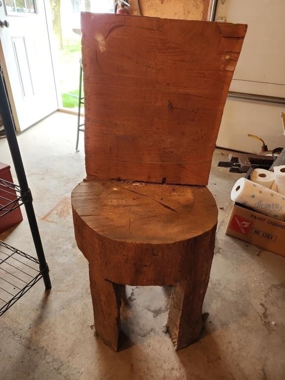 Heavy duty Wooden chair carved from a tree stump.