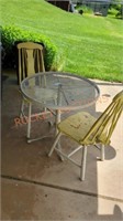 outdoor patio table with wooden chairs