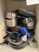 contents of cabinet , metal cookware