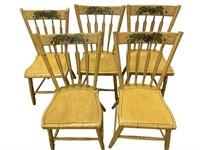 Five antique arrow back chairs
