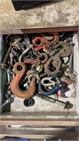 Tray of miscellaneous hooks, clamps, and pins