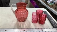 Cranberry glass pitcher with glasses