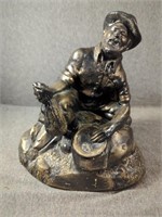 Ceramic Statue of Prospector Planning Gold,