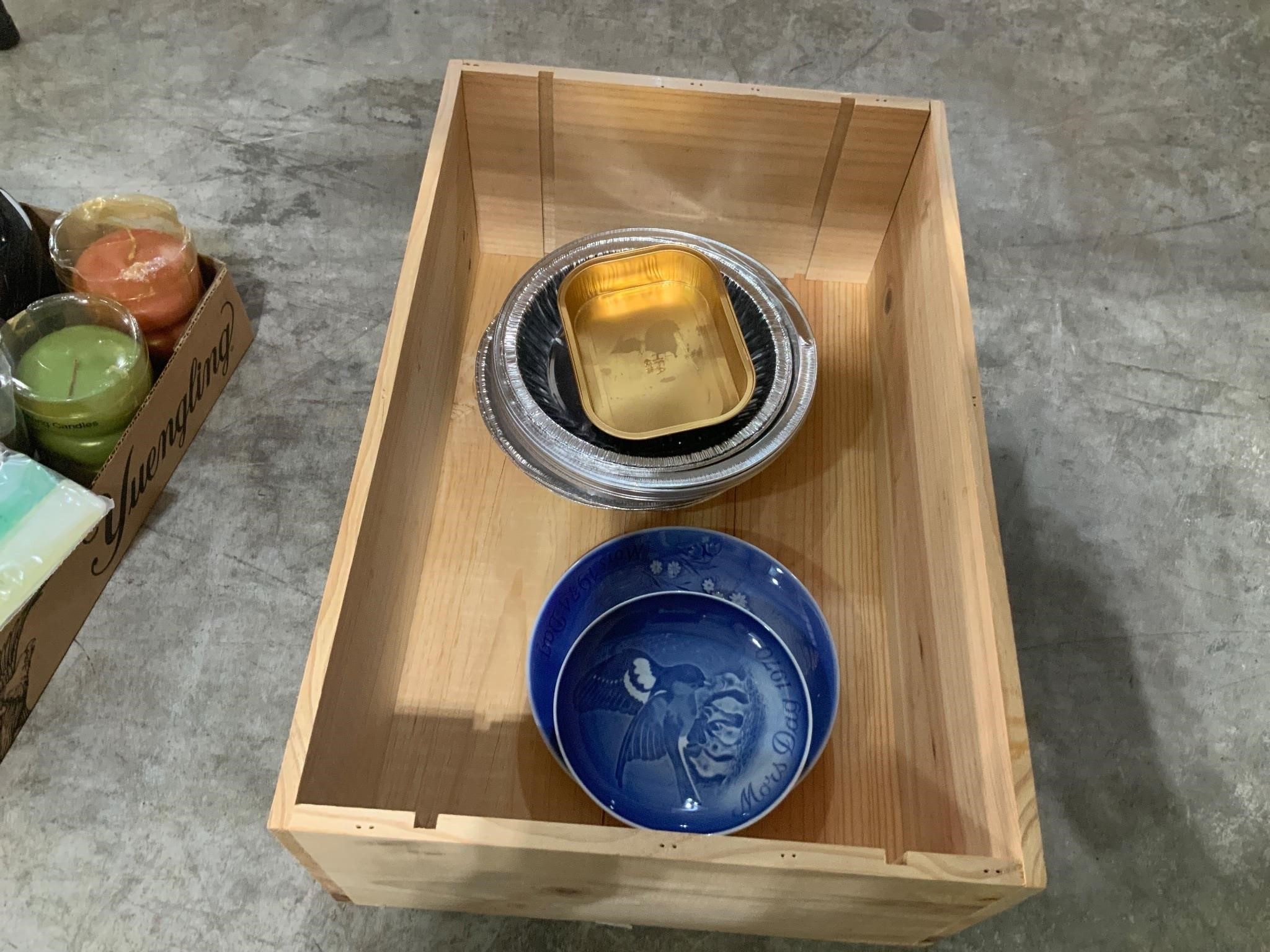 wooden wine box with plates and pie tins