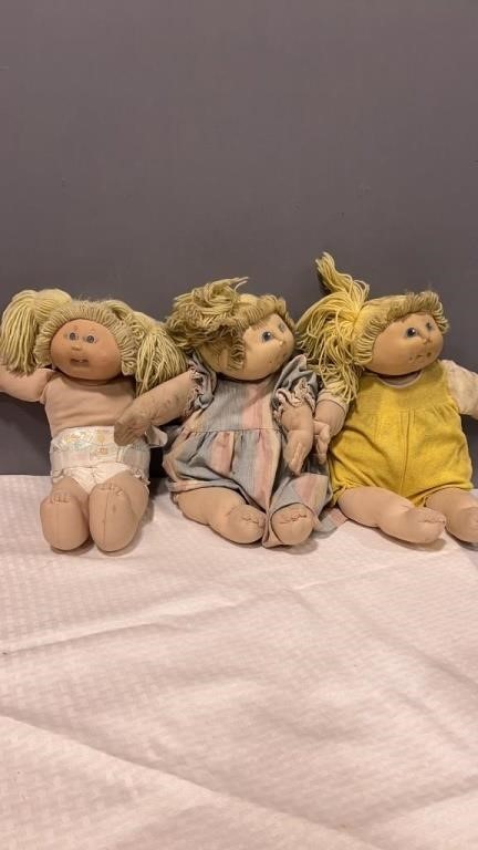 3 cabbage Patch Kids with lots of wear and tear.
