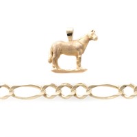 A Horse Pendant and Curb Link Bracelet in 14K
