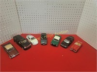 7 Diecast Cars - One is missing wheels