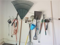 Lawn and garden tools hanging on wall