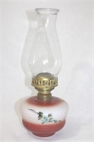 Vintage 1920s oil lamp with red floral design