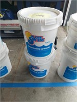 Two buckets of chlorinating granules