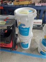 Two buckets of chlorine tablets