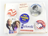 Assorted political campaign buttons, some from Ala