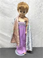 Large doll marked a-e and arrow on