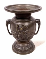 Bronze urn, elephant handles, figures on each