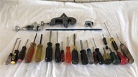 Assorted sizes of screw drivers and ridge tools